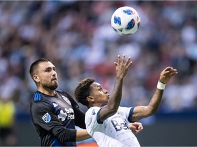 Yordy Reyna, right, attempts to gain control of the ball as San Jose Earthquakes' Jimmy Ockford defends during second half MLS soccer action in Vancouver, B.C., on Wednesday May 16, 2018.