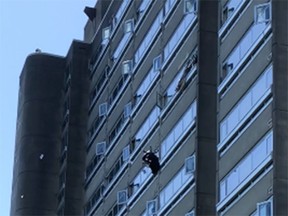 An office chair is thrown out of a window from a 19th-floor apartment in Vancouver's West End. A 56-year-old man was arrested and charged with several crimes.