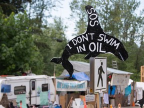 Lawyers for Trans Mountain will be back in court today to ask a British Columbia judge to amend an injunction order limiting people from protesting within five metres of two work sites in Burnaby. A sign is pictured at the front gates of Kinder Morgan's Trans Canada pipeline terminal on Burnaby Mountain in Burnaby, B.C., on May 29, 2018.