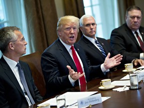 U.S. President Donald Trump speaks as U.S. Vice President Mike Pence, second right, Mike Pompeo, U.S. secretary of state, right, and Jens Stoltenberg, secretary general of the North Atlantic Treaty Organization (NATO), left, listen during a meeting in the Cabinet Room of the White House in Washington, D.C. U.S., on Thursday, May 17, 2018.