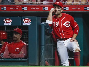 Cincinnati Reds first baseman Joey Votto watches from the dugout steps during a game against the Miami Marlins Sunday, May 6, 2018, in Cincinnati. (AP Photo/John Minchillo)