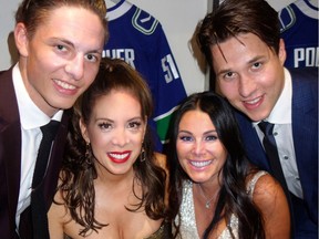 Vancouver Canucks defencemen Troy Stecher and Derrick Pouliot backed Clara Aquilini and Christi Yassin when the Reveal gala they co-chaired raised $1,123,695 for the Canucks Autism Network.