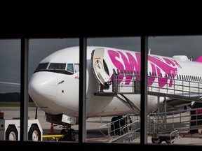 A Swoop Airlines Boeing 737 on display during their media event, Tuesday, June 19, 2018 at John C. Munro International Airport in Hamilton, Ont.