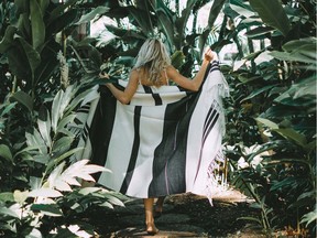A model wears a blanket from the Vancouver-based brand MINCA.