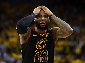LeBron James of the Cleveland Cavaliers reacts against the Golden State Warriors in Game 1 of the 2018 NBA Finals at ORACLE Arena on May 31, 2018 in Oakland, California.