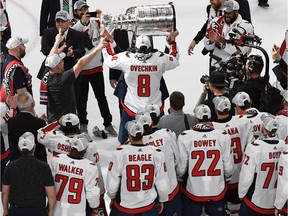 Alex Ovechkin of the Washington Capitals hands the Stanley Cup off after the team's 4-3 win over the Vegas Golden Knights in Game Five of the 2018 NHL Stanley Cup Final at T-Mobile Arena on June 7, 2018 in Las Vegas, Nevada.