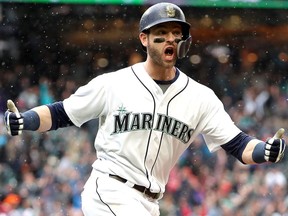 Mitch Haniger of the Seattle Mariners celebrates after hitting a game-winning, two-run homer in the ninth inning against the Los Angeles Angels on June 13 at Safeco Field in Seattle.