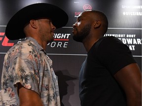 Donald Cerrone (left) and Leon Edwards do the staredown at a news conference to promote UFC Fight Night in Singapore on April 25, 2018.