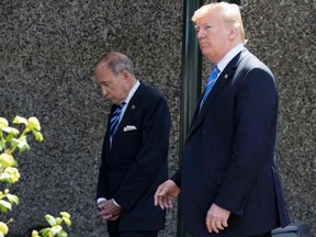 U.S. President Donald Trump, with economic adviser Larry Kudlow (left) in tow, leaves after a G7 summit session in La Malbaie, Quebec, on Friday, June 9, 2018.