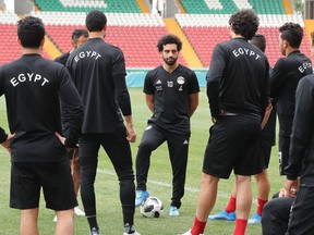 Egypt's forward Mohamed Salah speaks to his teammates during a training session in Grozny, Russia, on Sunday, June 17, 2018, for the FIFA World Cup.