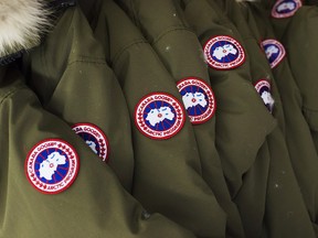 Jackets hang at the factory of Canada Goose Inc. in Toronto on November 28, 2013. Canada Goose Holdings Inc. announced it plans to open three new stores in North America this fall as part of its retail expansion plan. The stores will be in Short Hills, N.J., Montreal and Vancouver. The locations are expected to open ahead of the 2018 holiday shopping season.
