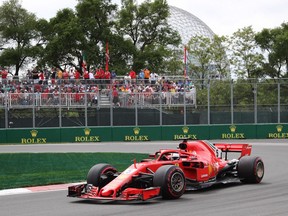Ferrari driver Sebastian Vettel of Germany drives through the hairpin on his way to winning the Canadian Grand Prix on Sunday in Montreal.