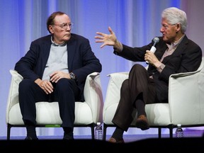 Former U.S. president Bill Clinton, right, and his co-author, James Patterson, talk about their book at the Vancouver Convention centre.