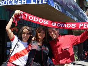 Anna Maria Tsougrianis, Romy Durand and Nick Tsougrianis show off their Peru pride Saturday outside Toscani Coffee Bar on Commercial Drive despite the team's loss to Denmark in the 2018 FIFA World Cup.