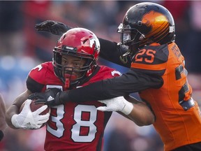 B.C. Lions' Winston Rose, right, tackles Calgary Stampeders' Terry Williams during CFL pre-season football action in Calgary, Friday, June 1, 2018.