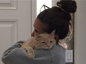 Alexandra Abbott holds Lily after she was returned home.