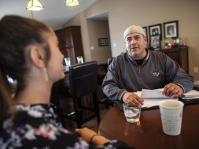 FCA worker Mike Malott, talks with his daughter Jada, 14, in their Windsor, Ont., home on Tuesday, June 12, 2018.