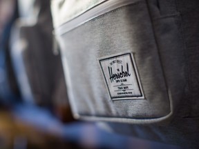 A Herschel Supply Company logo is seen on a backpack at the company's new flagship and first North American store, in Vancouver, on Monday June 11, 2018.