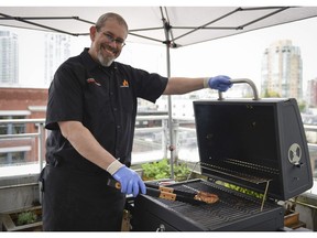 Canadian barbecue champion John Thomson prefers cooking on charcoal grills, but says it's important to choose a barbecue you're comfortable with and one that suits your lifestyle. Photo: Real Canadian Superstore for The Home Front: Getting set for barbecue season by Rebecca Keillor  [PNG Merlin Archive]