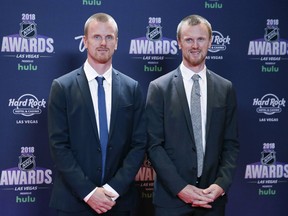 Daniel Sedin, left, and Henrik Sedin, formerly of the Vancouver Canucks, pose on the red carpet before the NHL Awards, Wednesday, June 20, 2018, in Las Vegas.