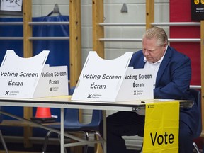 Former Chief Electoral Officer Keith Archer recommended that B.C. adopted the modern vote-counting system used by Ontario, which only needed 15 minutes after the polls closed Thursday to reveal that PC leader Doug Ford, shown here voting in Toronto, was elected premier.