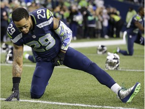 Seattle Seahawks free safety Earl Thomas stretches before an NFL game against the Carolina Panthers in December 2016 in Seattle.