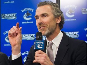 How much will the Canucks improve next season? Trevor Linden and his NHL troops hope more than what he's indicating in this photo. The Canucks, despite having $23 million extra to spend, insist they will continue with the youth movement.