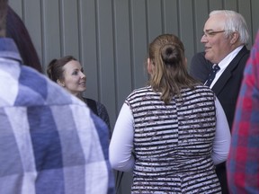 Winston Blackmore is greeted by family and supporters outside B.C. Supreme Court in Cranbrook, during a break in proceedings Tuesday, May 15. A sentencing hearing was underway for Blackmore and James Oler, both of Bountiful, B.C., for polygamy charges.