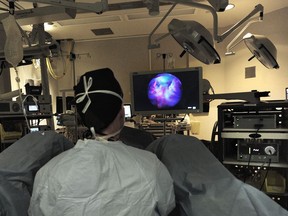 Dr. Peter Black performs a cystoscopy imaging procedure using blue light and a fluorescent dye at UBC Hospital on May 31, 2018.