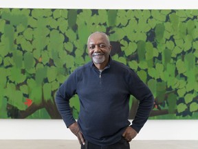 Artist Kerry James Marshall poses in front of Untitled (Green) for a photo at the Rennie Museum prior to an opening of an exhibition of 33 of his works.