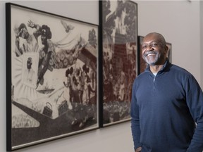 Artist Kerry James Marshall in front of his triptych Untitled (Black Empire Suite), charcoal and crayon, at the Rennie Museum.