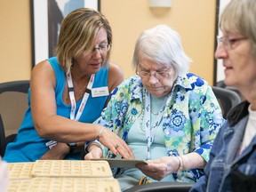 Karen Baillie (left) CEO of Menno Place, plays bingo game with Anne Braun at Menno Place in Abbotsford, June, 1, 2017.