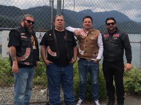 Photo of Burnaby firefighter Nick Elmes, far right, a founding member of Florian's Knights, with Hells Angels Kelowna president Damiano Dipopolo beside him, then two other Kelowna Hells Angels.
