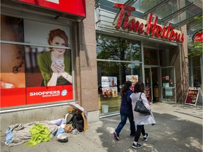 The Tim Hortons on West Broadway near Laurel in Vancouver on June 6. Witnesses said Ted, whose last name isn't known, may have been slumped at his table, unresponsive, for several hours before he was noticed last week. The 74-year-old spent his final hours in a spot where he had spent much of the last years of his life: at a nook in a city Tim Hortons.