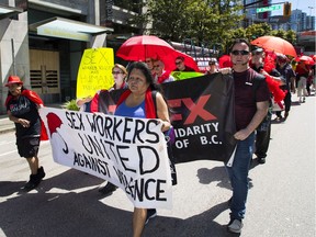 The Red Umbrella March in June marked 130 years of resistance against what organizers called Canada's 'unfair' prostitution laws. (Francis Georgian/PNG FILES)