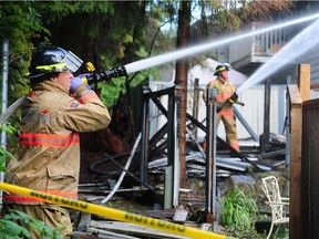 Fire fighters on scene as two people are dead and at least a 16 others are injured following an early-morning apartment fire in Lynn Valley in North Vancouver, June 11, 2018.