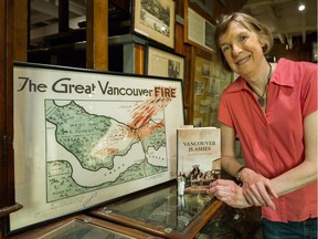 Lisa Smith with a map of Vancouver's Great Fire and her book, Vancouver is Ashes, at the Hastings Mill Museum in Vancouver on June 12. The museum will be honouring the First Nations people who helped save Vancouverites during the fire of June 13, 1886.