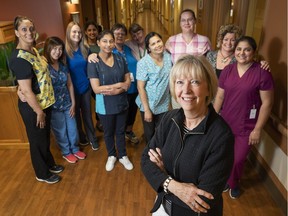 Chief Executive Officer Of Langley Lodge Care Home Debra Hauptman (right) poses for a photo with her staff.