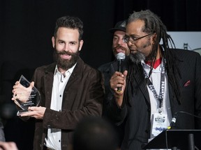Mike Matthews of Bella Vista Cannabis (left) poses for a photo with the trophy for most innovative pitch. He is now in the running to win 1 million dollars at the International Cannabis Business Conference in Vancouver, BC, June, 25, 2017.