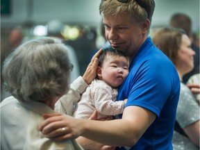 VANCOUVER, BC - JUNE 26, 2018 - Ryan Hoag holds his adopted daughter at Vancouver International Airport in Richmond, BC, June 26, 2018.  The family returned home with the newborn baby adopted from Japan. The couple and child were stuck in limbo after a visa flap.  (Arlen Redekop / PNG staff photo) (story by Jennifer Saltman) [PNG Merlin Archive]