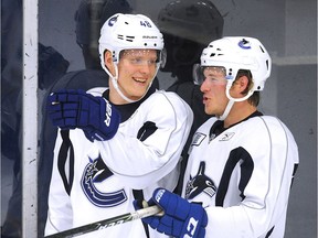 Olli Juolevi, left, is expected to rub camp shoulders with Brock Boeser.