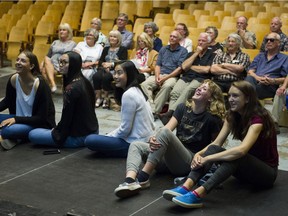 Members of the Point Grey Secondary Grad class of 1968 and grads from 2018 watch a short film that introduces students to the school at a meeting between the two grad classes, Vancouver, June 22 2018.