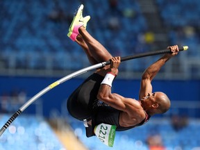 Canada's Damian Warner achieves liftoff in the men's decathlon pole vault competion at the 2016 Summer Olympics in Rio de Janeiro, where he earned a bronze medal.