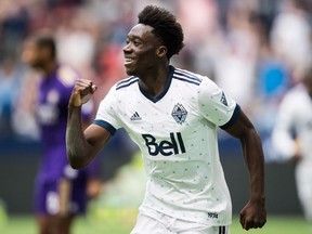 Vancouver Whitecaps' Alphonso Davies celebrates his goal against Orlando City during the second half of an MLS soccer game in Vancouver, on Saturday June 9, 2018.