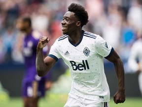 Whitecaps' Alphonso Davies celebrates his goal against Orlando City during an MLS game in Vancouver on June 9.