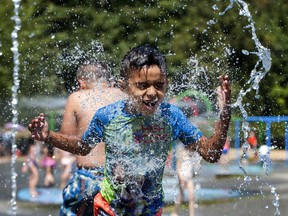 Kavir Bahd, 7, cools down at the splash park in Stanley Park.