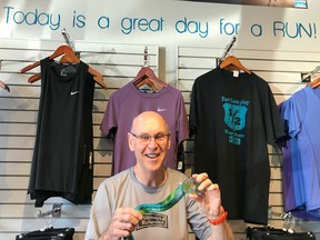 Dave Palmer, a veteran sales associate with PEN RUN in Langley, shows off the race bling from last year's Fort Langley Half Marathon and 5K. Palmer, a race-day official for the scenic half and 5K, says interest in the Sunday, July 15 event continues to grow.