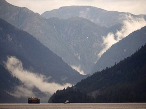 A tug tows a large barge along Princess Royal Island, B.C. Thursday, Sept, 19, 2013.