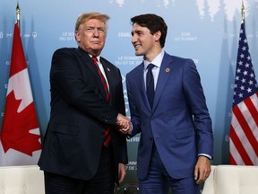 President Donald Trump meets with Canadian Prime Minister Justin Trudeau during the G-7 summit on June 8 in Charlevoix, Que.