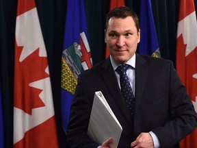 Economic development and trade minister Deron Bilous leaves the podium after speaking at the Alberta Legislature in Edmonton about President Donald Trump's decision to pull out of the Trans Pacific Partnership, Monday, January 23, 2017. Ed Kaiser/Postmedia